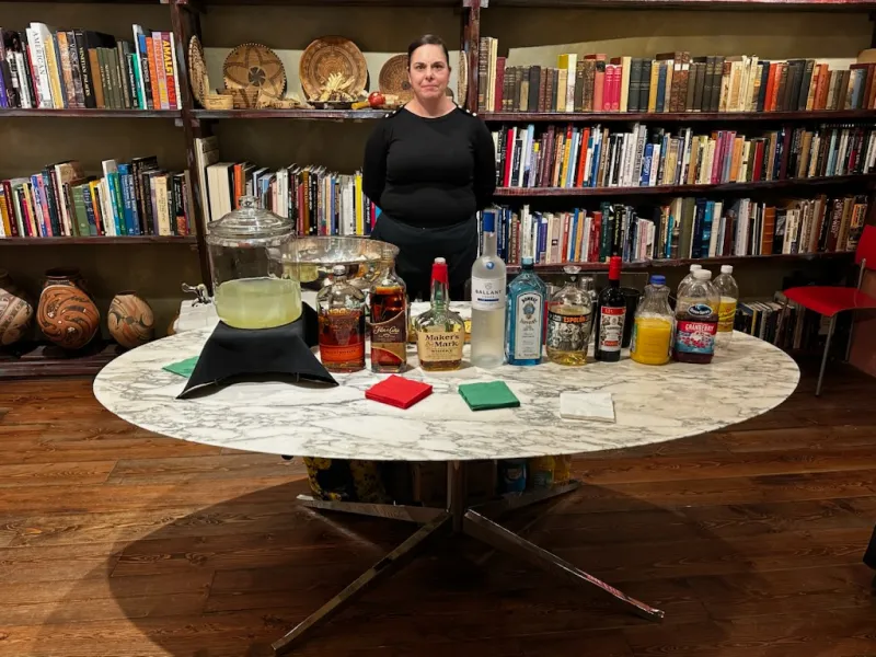 Bartender serving guests at an indoor event bar