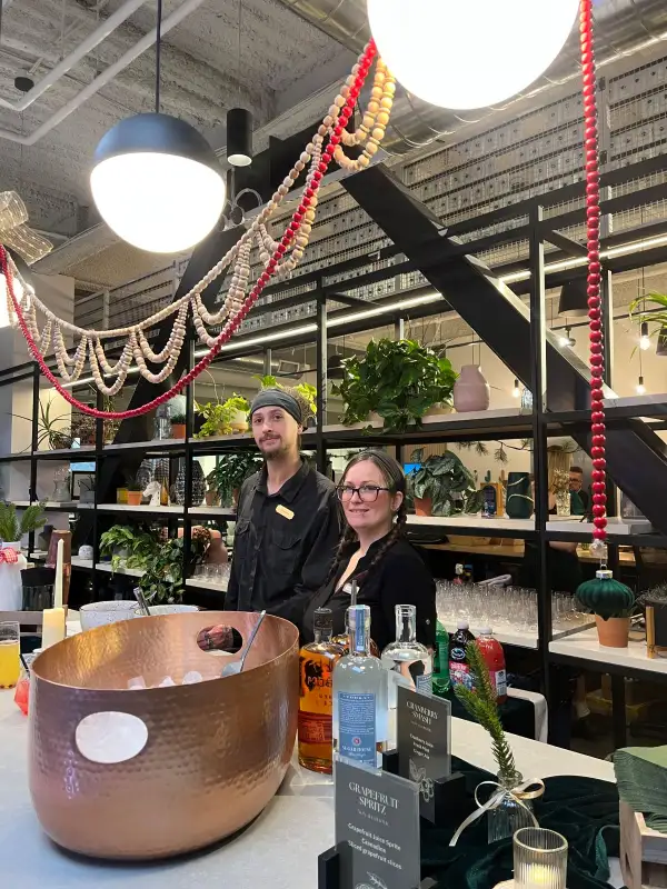 Bartender preparing a refined indoor event bar.