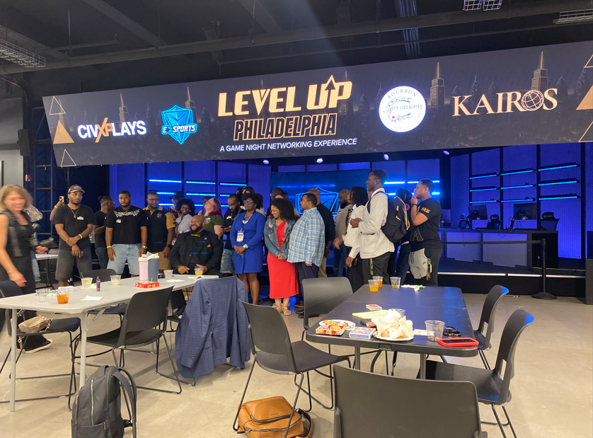 Corporate event guests near a staffed bar.